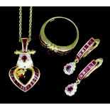 A modern suite of 18ct gold ruby and diamond set jewellery comprising of a heart pattern pendant set