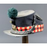 A 19th Century Scots Guards Officer's Shako, bearing a brass regimental plate, green pompom cockade,