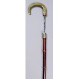 A 19th Century novelty walking stick with bamboo shaft, the horn handle unscrewing to reveal a steel