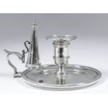 An Elizabeth II plain cast silver circular chamber candlestick of "Georgian" design, with moulded