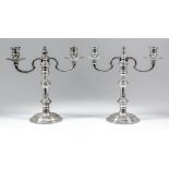 A pair of Elizabeth II silver two light candelabra, the knopped stems with twin C-scroll branches,