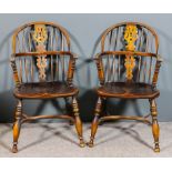 A pair of 20th Century ash and elm seated "Nottinghamshire" Windsor stick back armchairs, the two