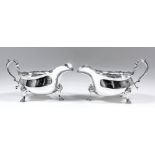 A pair of George V silver James pattern sauce boats with scroll moulded rims and on scroll feet, 3.