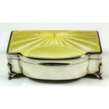 A George V silver rectangular bow front jewellery box with yellow guilloche enamel panel to top,