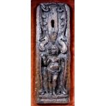 A 17th Century Low Countries oak carved panel of the naked Christ child as Salvator Mundi, his right