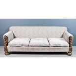 A Victorian oak three seat settee upholstered in grey/fawn "Florentine" style dralon and with