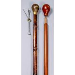 An early 20th Century novelty walking cane, the shaft impressed and lettered in gold "J. T. Burton",