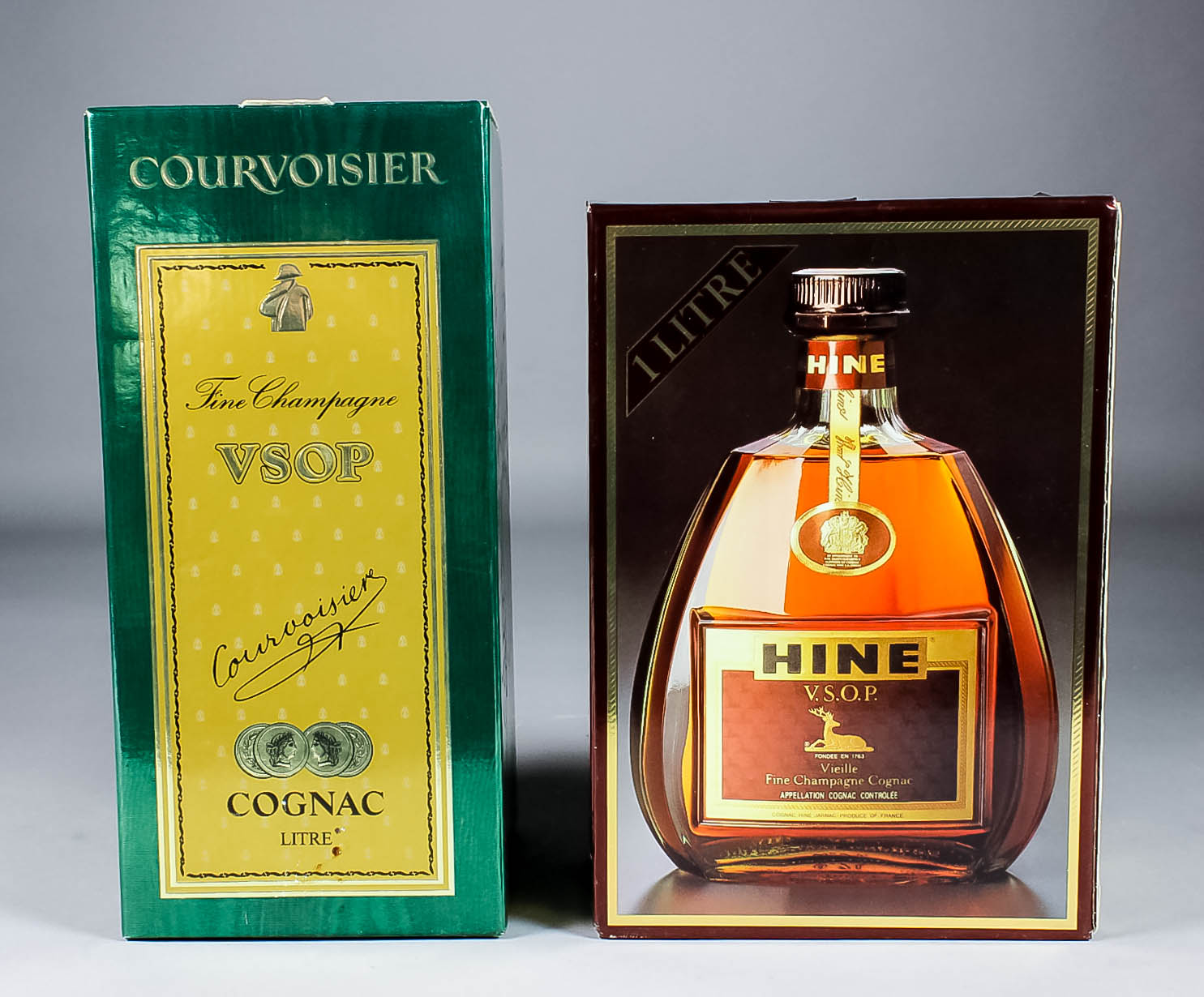 Three one litre bottles of Camus Celebration Cognac (40% proof), two one litre bottles of Hine