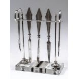 A George V silver and glass manicure set stand of "Art Deco" design, of rectangular form, on slender