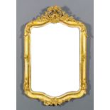 A French gilt and cream painted rectangular wall mirror of "Louis XV" design, the shaped and moulded