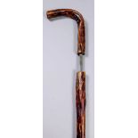 A 19th Century composite walking stick sword stick with briar shaft, the 22.75ins square steel blade