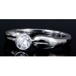 A modern platinum mounted diamond solitaire ring, the collet set stone of approximately .35ct (gross