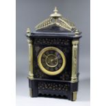 A late 19th Century French mantel clock, No. 9322 64, the 4.5ins black enamelled metal dial with