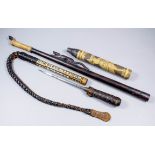 An Asian plaited leather whip with bone and mother of pearl wooden shaft, the leather covered handle