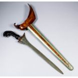 A Java Keris Lurus from Surakarta, 12ins straight blade, carved hardwood grip, plain brass scabbard,