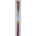 A 19th Century German composite walking cane sword stick with bamboo shaft, the 26ins square section