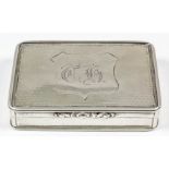 A George III silver rectangular snuff box with moulded mounts and engine turned panels, the lid