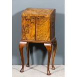 A 1930's figured walnut work/writing cabinet with spindled turned gallery (now in pieces in