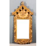 A Victorian carved oak framed church notice board with pointed arched top, carved fleur de lis