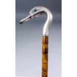An early 20th Century silver "swans head" pattern walking stick, the handle modelled as a swan head,