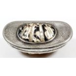 An 18th Century silvery metal mounted cowrie shell pattern snuff box, the mounts engraved with