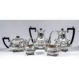 A harlequin George V silver five piece tea and coffee set with shell scroll and gadroon mounts,