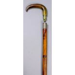 A 19th Century novelty walking stick, the cane shaft with engraved silver band, Birmingham 1889,