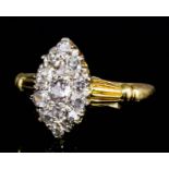 An 18ct gold all diamond set marquise pattern ring, the face pave set with fifteen old cut stones (