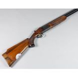 A 12 bore over and under shotgun by Miroku, Serial No. 726795, 26ins blued steel barrel with