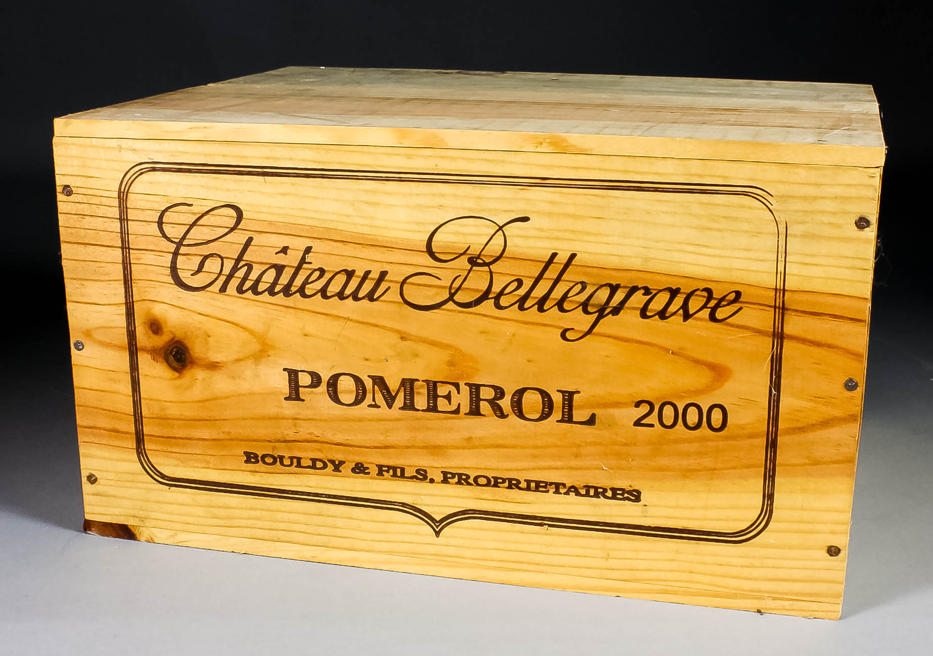 Six bottles of 2000 Chateau Bellegrave (Pomerol) (contained in sealed wooden case)