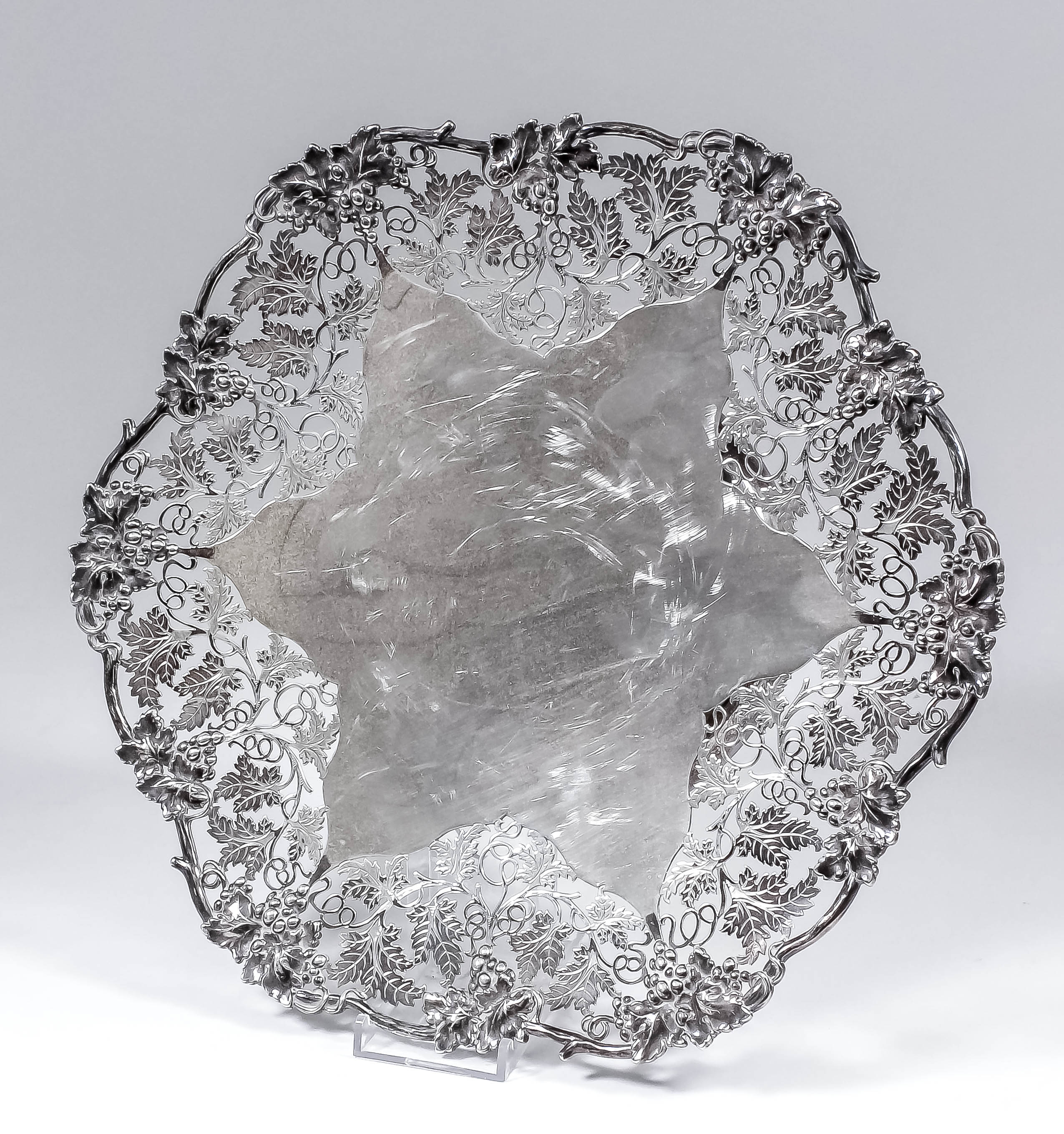 A George VI silver tazza of shaped outline, the border pierced and cast with fruiting vines, on