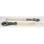 A Victorian silver mounted and ivory letter opener/page turner, the handle cast in the form of a
