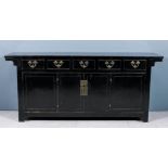 A Chinese black lacquer sideboard, fitted five frieze drawers, cupboard under enclosed by a pair