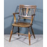 A 19th Century ash and elm seated "Mendlesham" Windsor armchair with low square back, the fretted