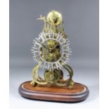 A brass framed skeleton clock, the 6.5ins diameter fretted silvered chapter ring with Roman