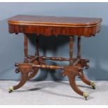 An unusual late Georgian mahogany D-shaped tea table with moulded edge to plain folding top,