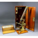 A late 19th Century lacquered brass binocular microscope by Negretti & Zambra, London, 15.25ins