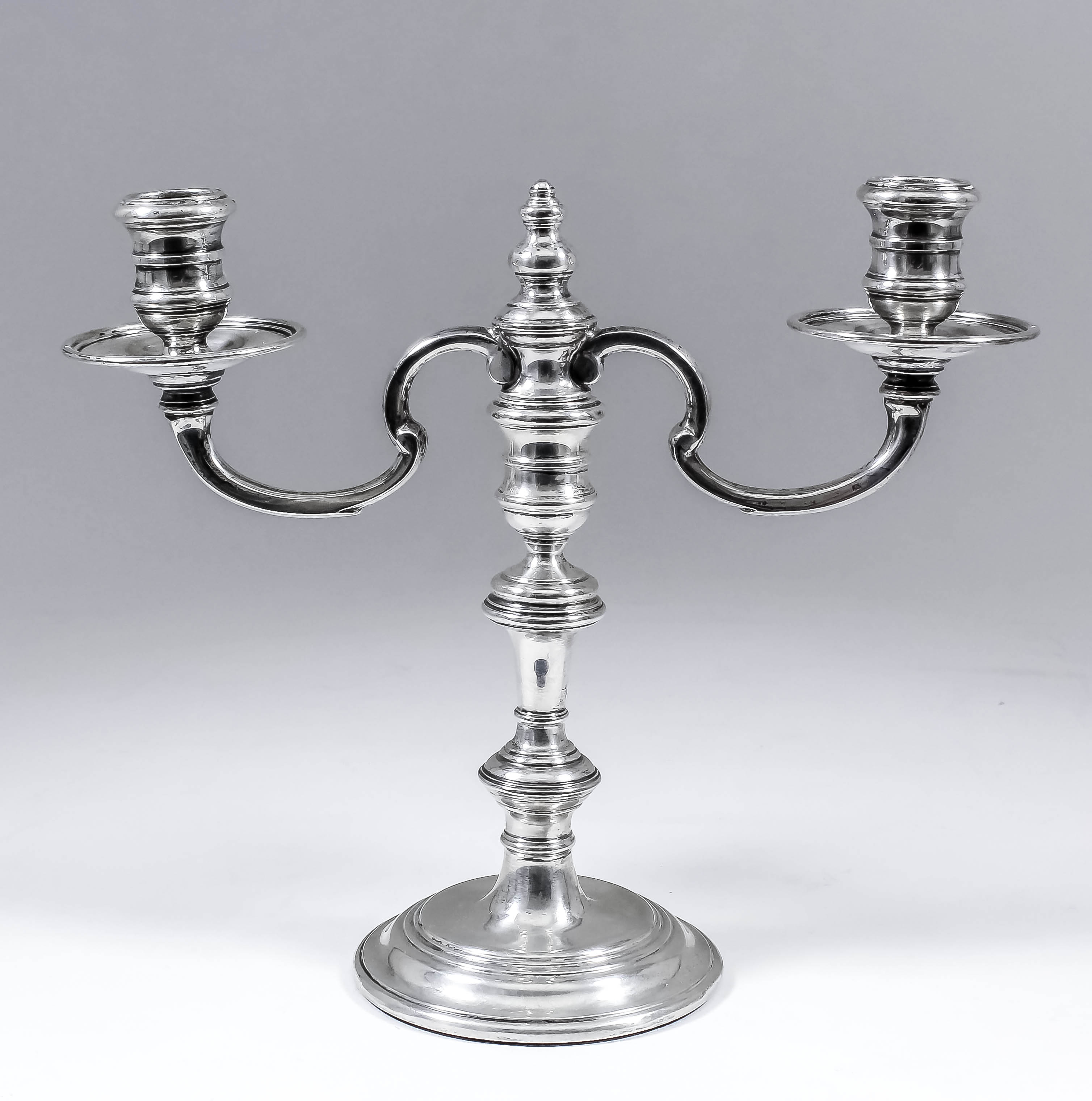 An Edward VII silver twin branch candelabrum, the knopped stem with double C-scroll branches, with