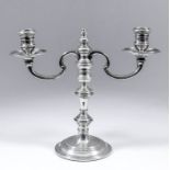 An Edward VII silver twin branch candelabrum, the knopped stem with double C-scroll branches, with