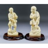 Two Japanese carved ivory Okimono of a standing woodcutter, an axe in his right hand and a pipe in