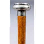 A 19th Century novelty walking cane, the plated knop of depressed form, with a hinged lid, 34.5ins