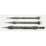 A George IV silver combined propelling pencil and pen of reeded and fluted form and with floral