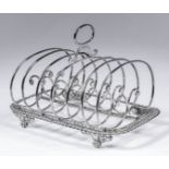 A George IV silver rectangular six division toast rack with gadroon mounts, wirework scroll