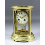 An early 20th Century French brass oval "Four Glass" mantel clock by Japys Freres, No. 2875 3 11,