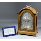 An Elizabeth II "Silver Jubilee" mahogany cased mantel clock designed and manufactured exclusively