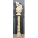 An early 20th Century Italian alabaster table lamp and pedestal, the lamp with turned veined