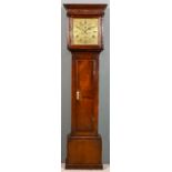 An 18th Century oak longcase clock by Phillips of Bromyard, the 12ins square brass dial with wide