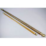 A 20th Century novelty walking cane, the halved shaft concealing further section to make up a