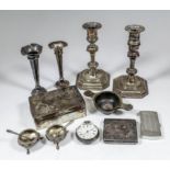 A pair of late Victorian silver pillar candlesticks with urn sconces, octagonal knopped stems and