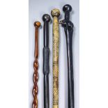 A 20th Century African hardwood walking cane, the handle carved as a water buffalo and with circular